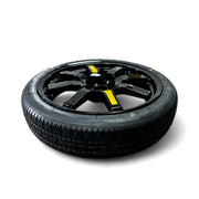 Top view of 17-inch EZ Spare Wheel with gloss black alloy finish and yellow safety speed labels.