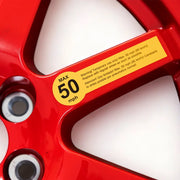 close up image of the EZ Spare wheel with the warning sticker sign