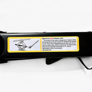 Close-up view of the manual instructions label on a 2.5-ton black scissor jack, outlining proper usage guidelines and safety precautions with an illustrative diagram.